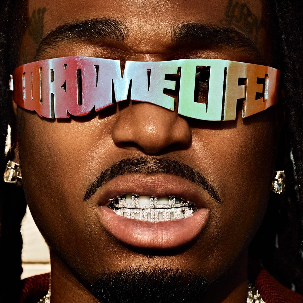 QRÖMELIFE album cover: close-up of Quavo wearing chrome sunglasses that spell QRÖMELIFE and a diamond grill