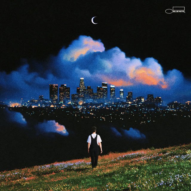 Memory Bomb album cover by Kiefer: a man in overalls walking on a hill above the Los Angeles skyline at night