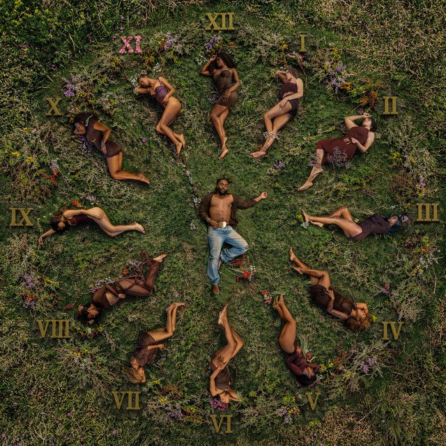 THE 11TH HOUR album cover: Johnny Venus lying in the grass at the center of a clock made of people and Roman numerals