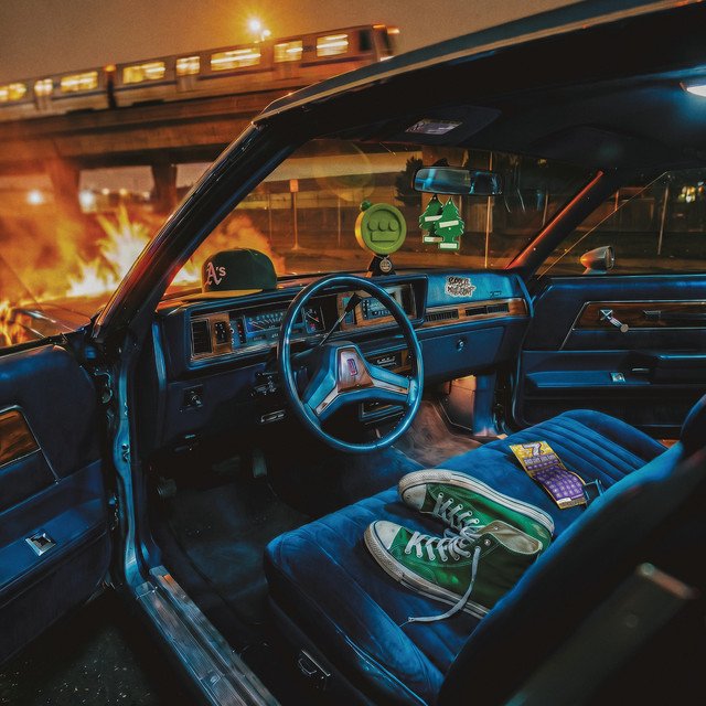 Clean Getaway EP cover: the blue interior of a classic car parked under a train bridge at night, with green sneakers on the seat
