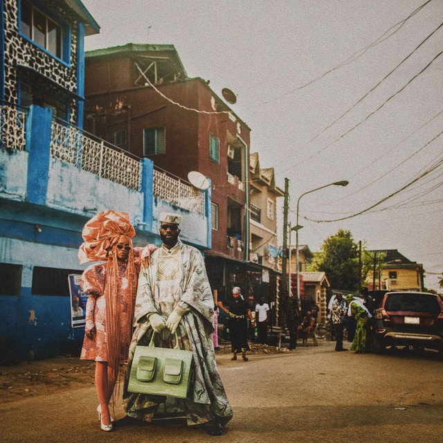 THE BRIDGE album cover: Tobe Nwigwe in a white robe next to a person in a colorful outfit on a busy street